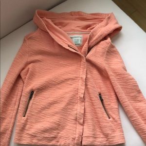 Bright orange hoodie from Anthropologie